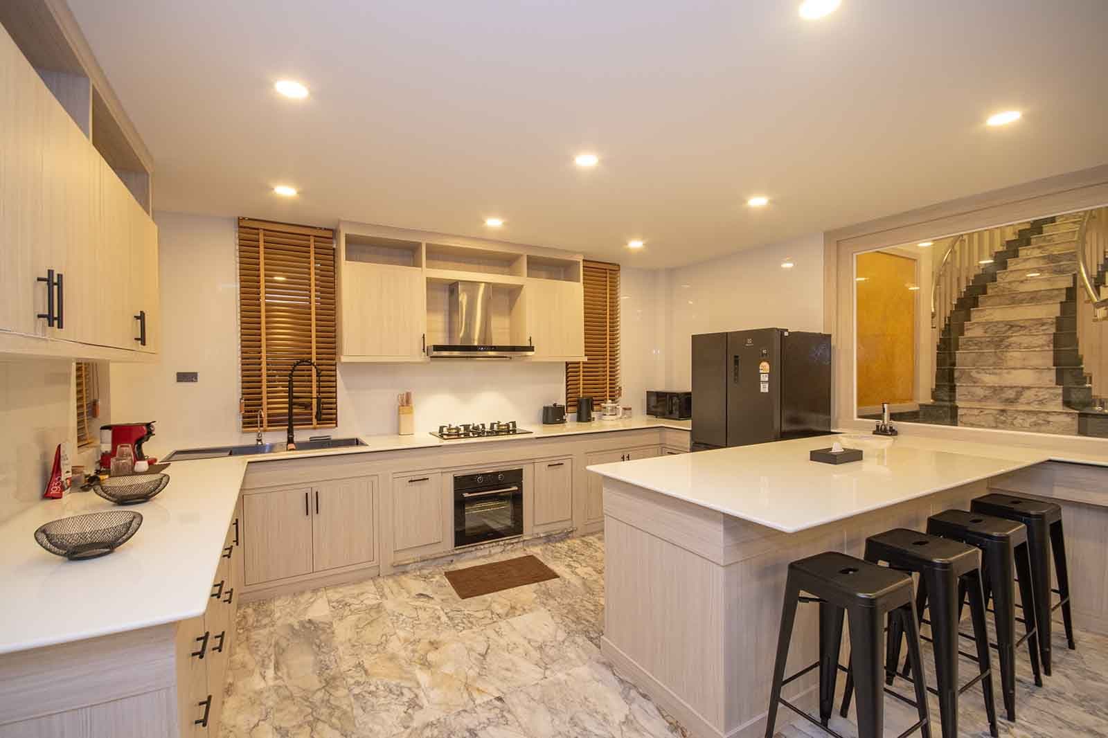 The kitchen, with island and bar seating