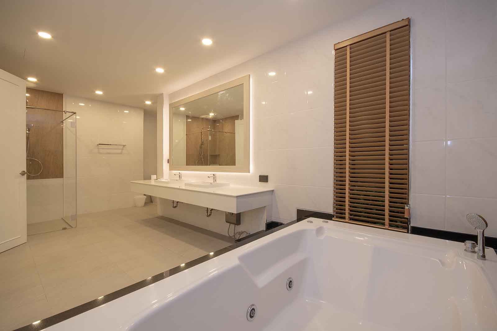 The master bathroom, with jacuzzi bath and walk-in shower